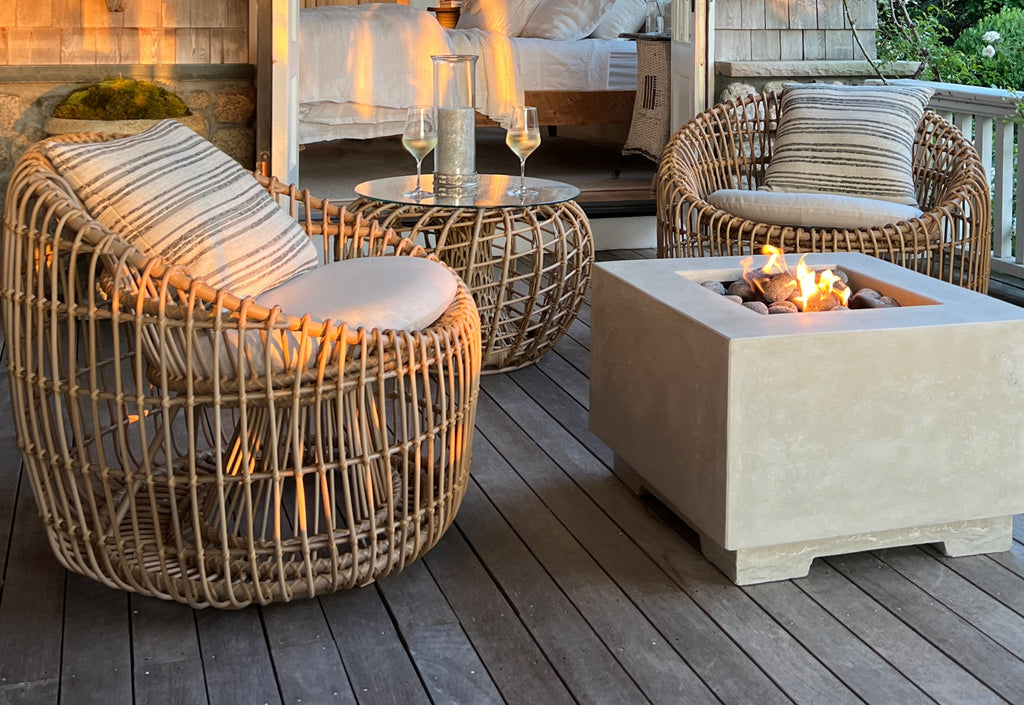 Sunset on the veranda with cosy Nest round chairs and coffee table with glass top from Cane-line