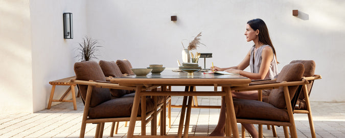 A stylish dining setup featuring comfortable chairs and a modern table, perfect for enjoying meals in a relaxed atmosphere.