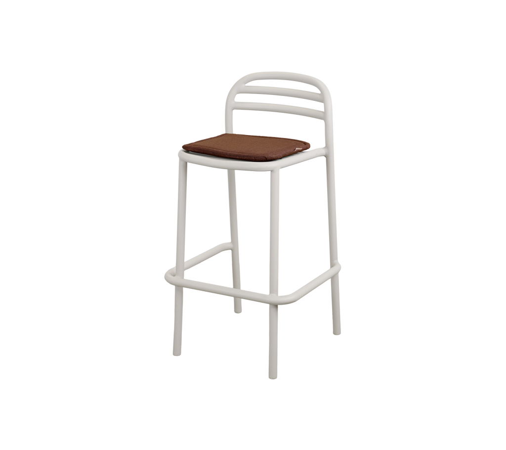 Modern bar stool with a sand frame and brown seat.