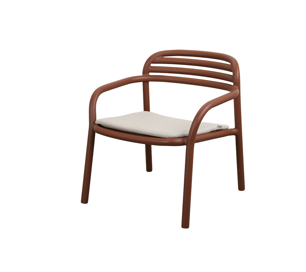 Modern desert red chair with a sand cushion.