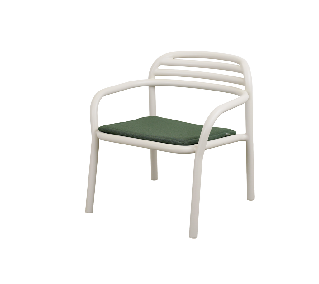 Modern chair with a light green cushion.