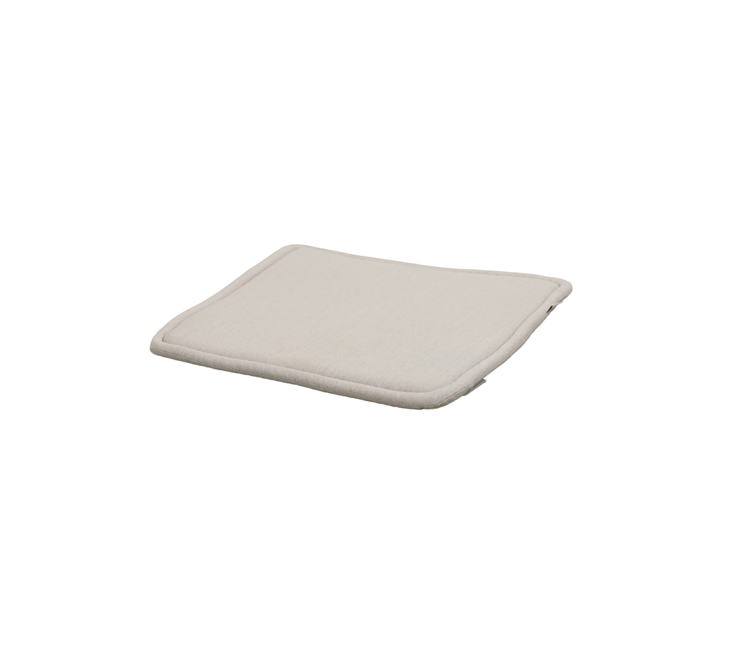 Sand cushion with a soft, curved design and no visible patterns.