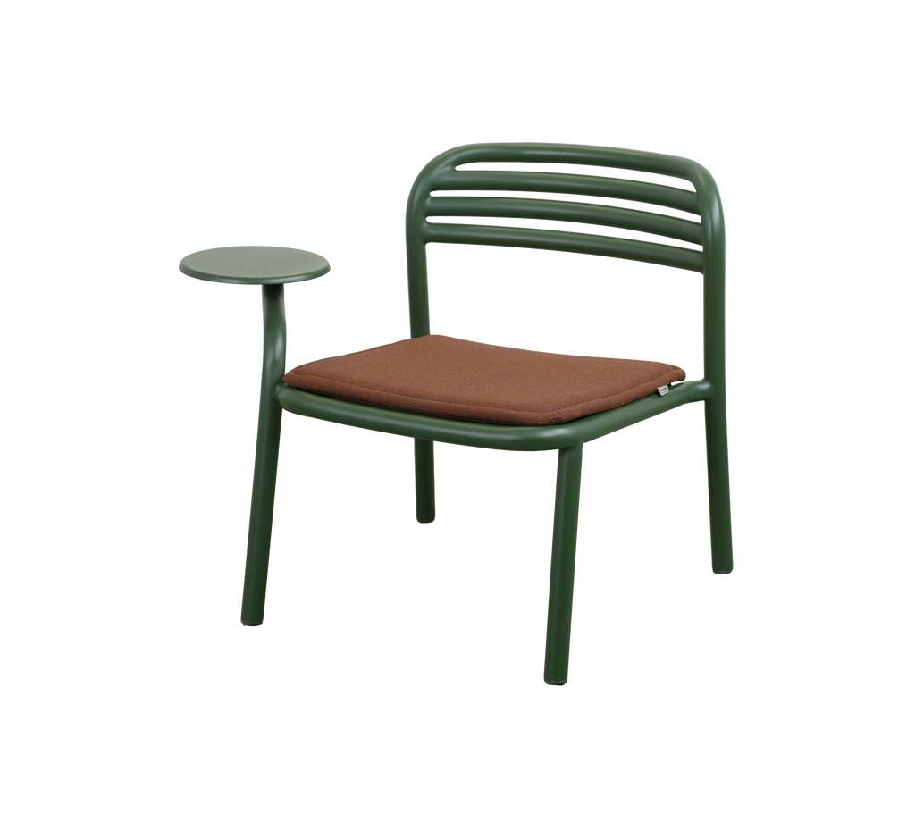 Modern chair with dark green frame and desert red cushion.