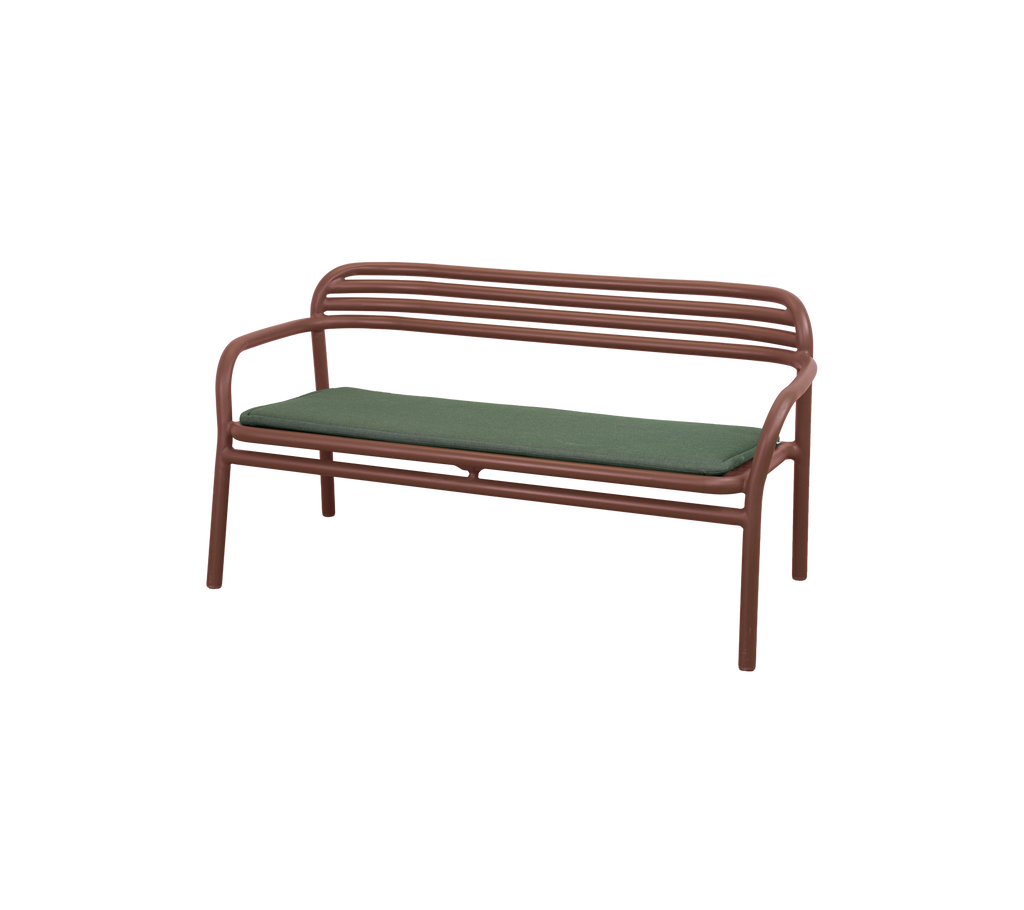 Desert red bench with a light green cushion.