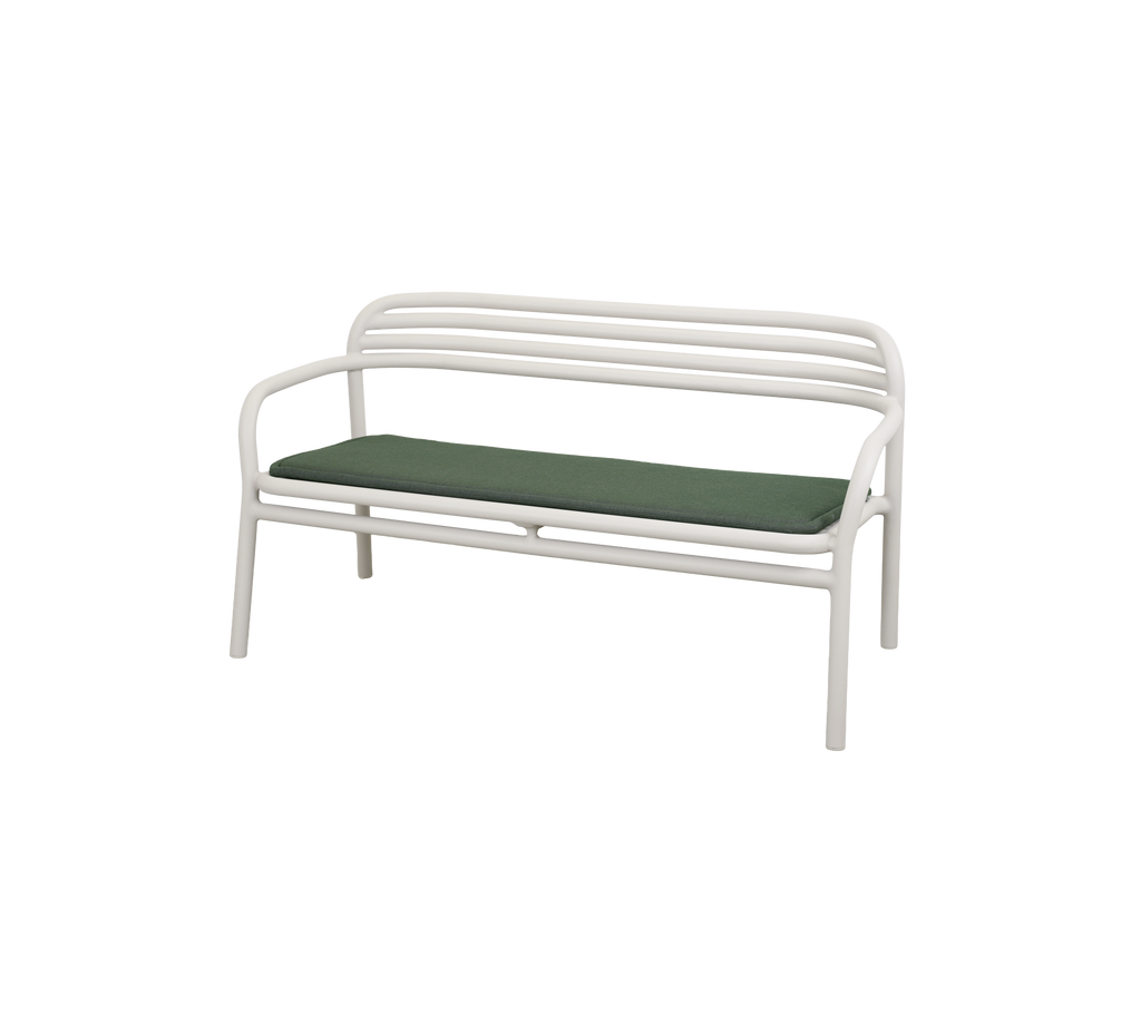 Modern bench with light green cushion.