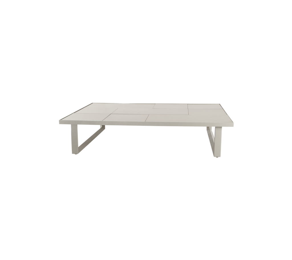 Modern sand-colored table with a minimalist design.
