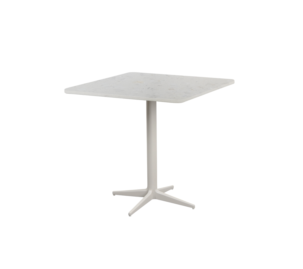 Square white table with a four-legged base.