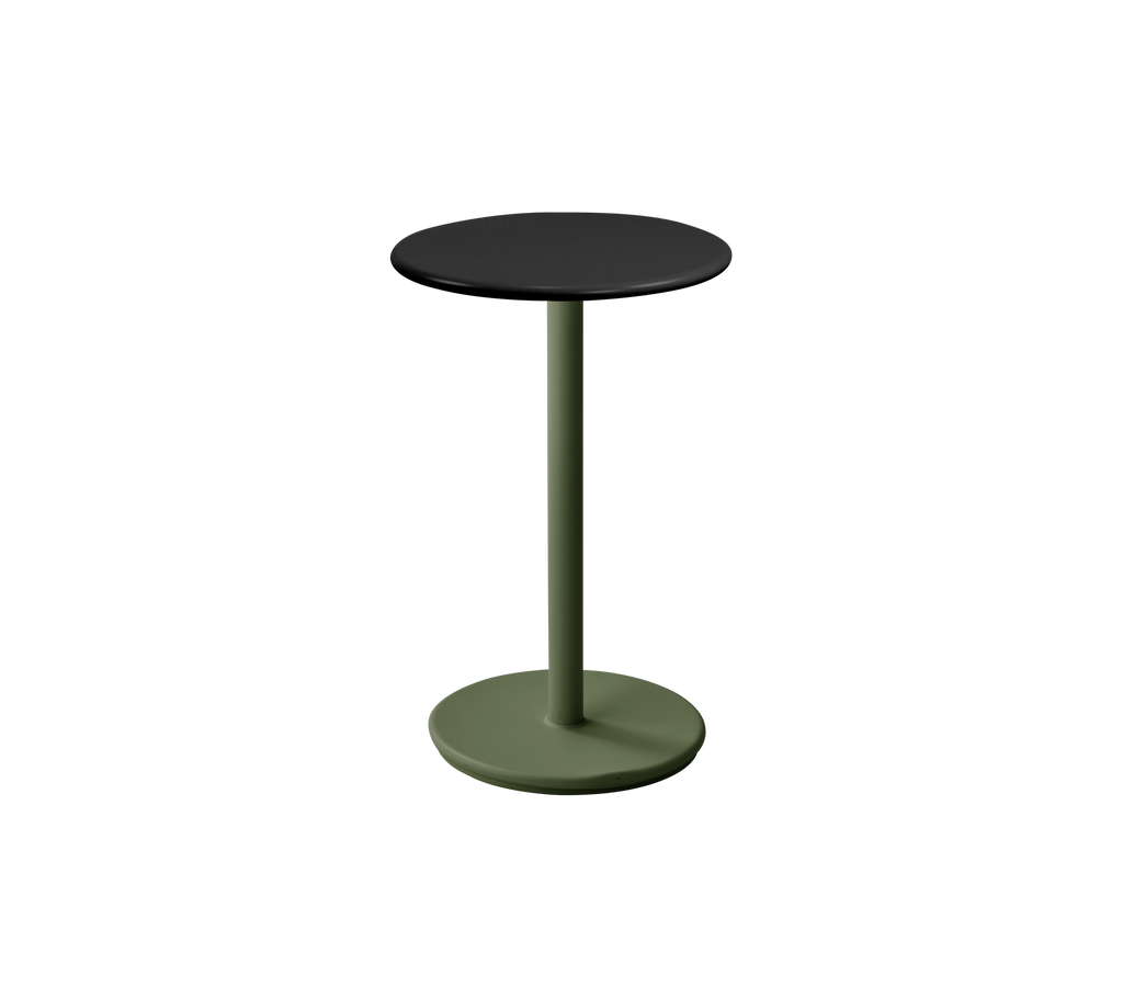 Modern dark green table with a black top.