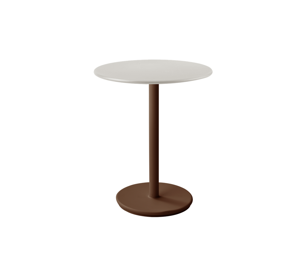 Modern white table with desert red base in a stylish lounge setting.