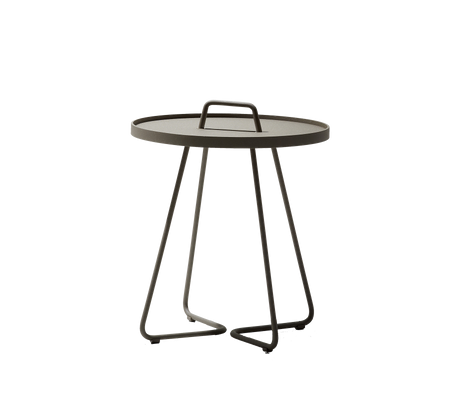 Round table with a sleek design, featuring a carrying handle and a minimalist base. Perfect for any modern setting.