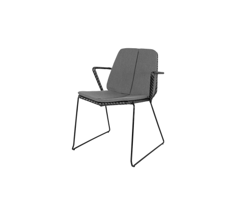 Stylish chair with a sleek design, featuring a comfortable seat and backrest, supported by a sturdy metal frame.