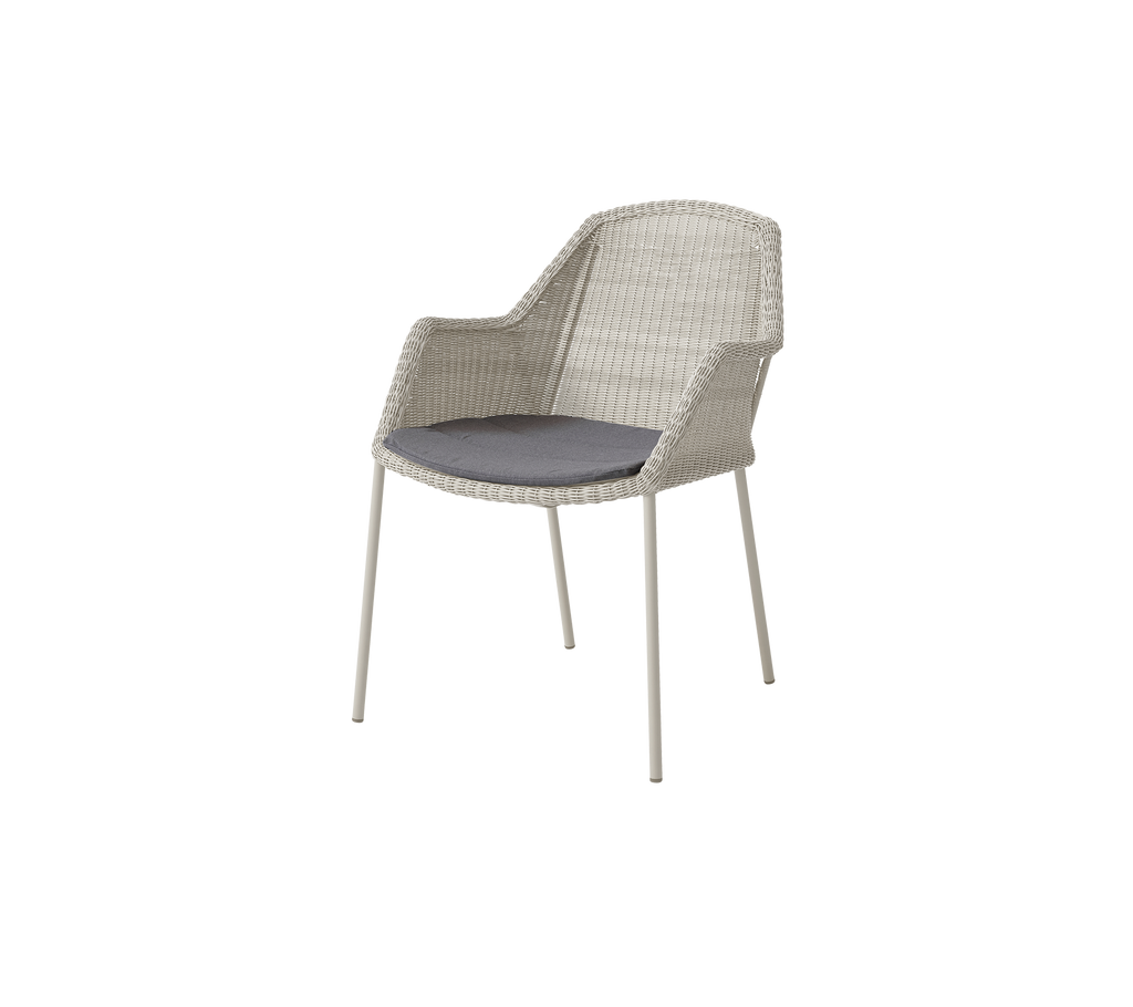 Modern sand chair with a grey cushion.