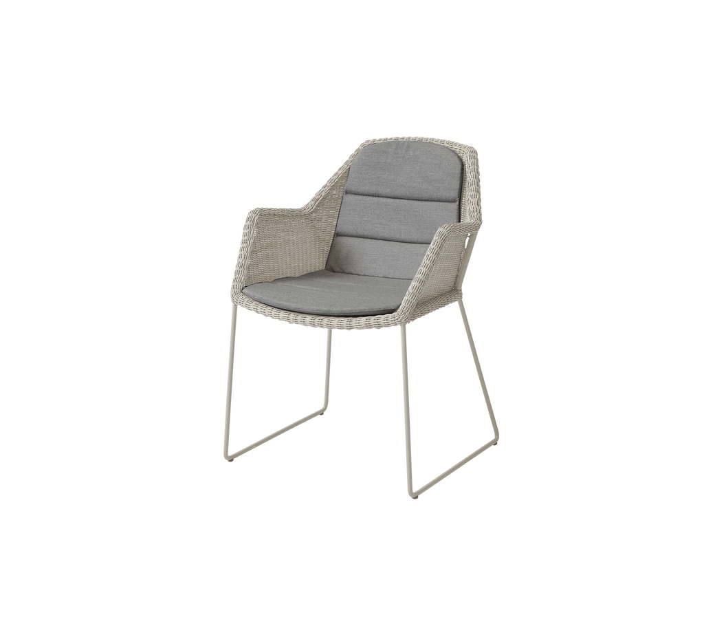 Modern chair with a grey cushion in a contemporary design.