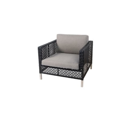 Stylish armchair featuring a woven structure and a comfortable light gray cushion, perfect for modern seating arrangements.
