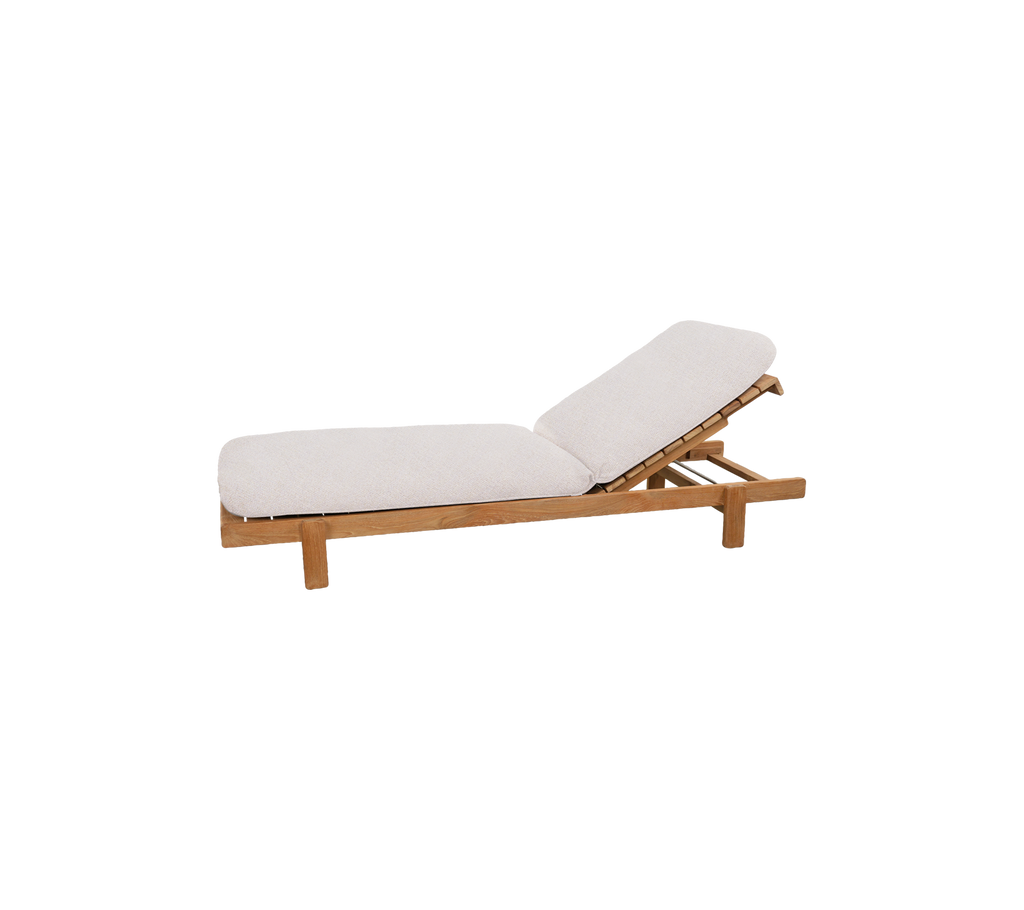 Teak lounge chair with sand cushion in a modern design.