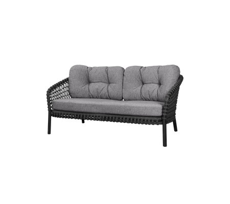 Two-seater sofa with a woven frame and plush gray cushions, designed for comfort and style. Perfect for seating in any space.