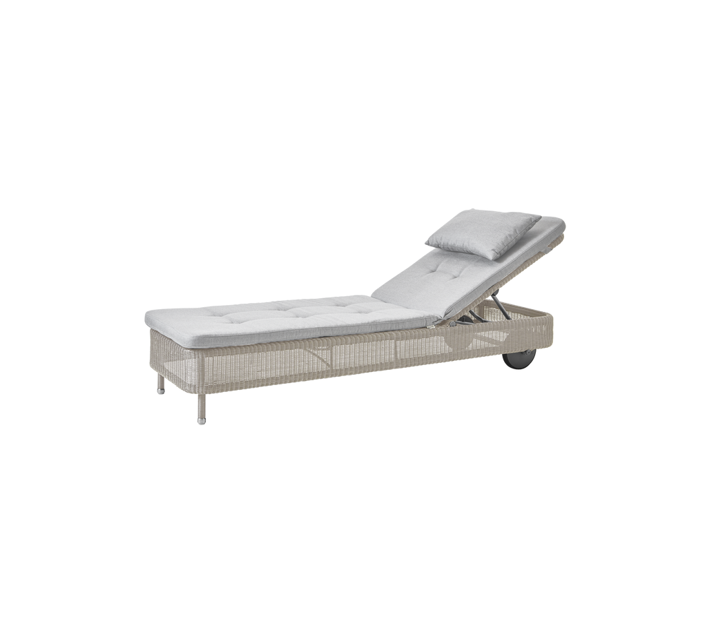 Light grey lounge chair with adjustable backrest.