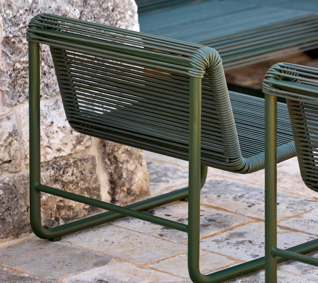 Modern green chair featuring a sleek, minimalist design.