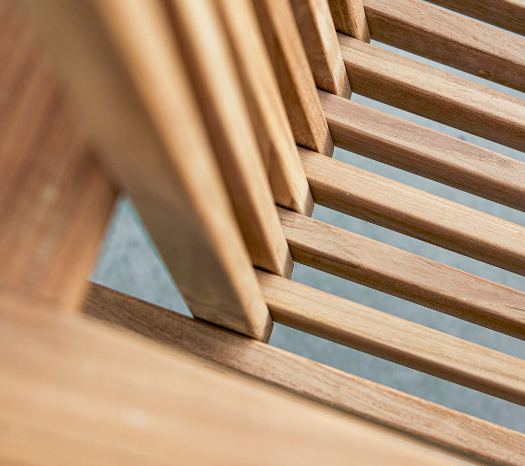 Close-up view of wooden slats, showcasing the natural grain and texture in a stylized arrangement.