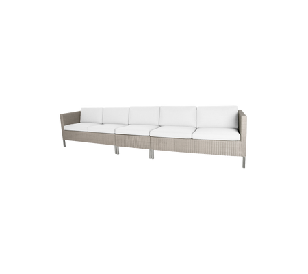 Sleek sectional sofa with a light beige frame and plush white cushions, perfect for dining or lounging.