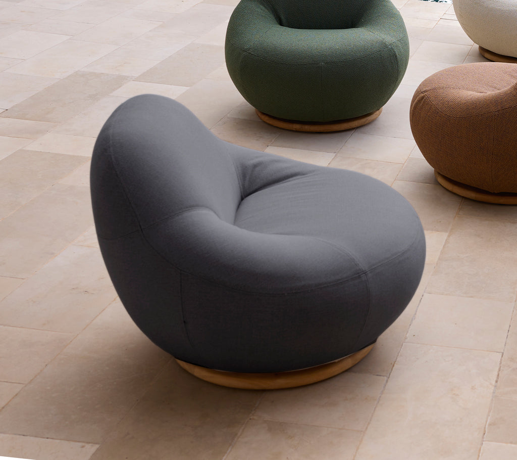 Modern grey chair with a rounded shape and a wooden base.