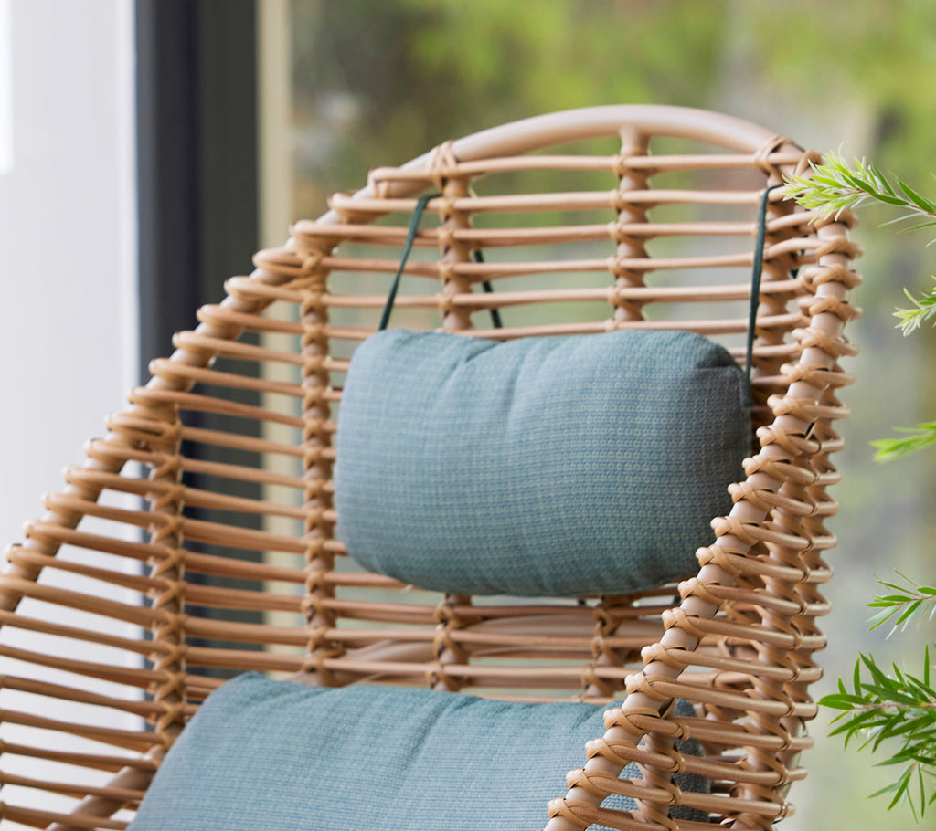 Hive highback chair featuring a supportive neck cushion and woven structure, ideal for comfortable sitting in a stylish design.