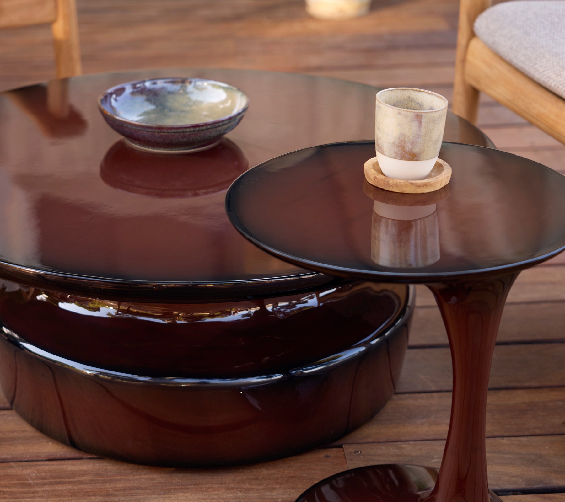 Modern brown coffee and side tables with ceramic bowl and glass candle.
