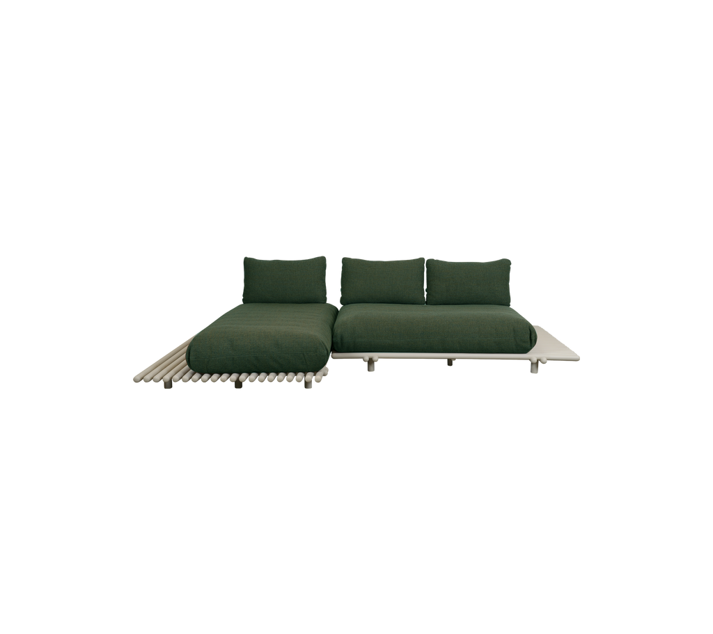Modern dark green sofa with a minimalist design.