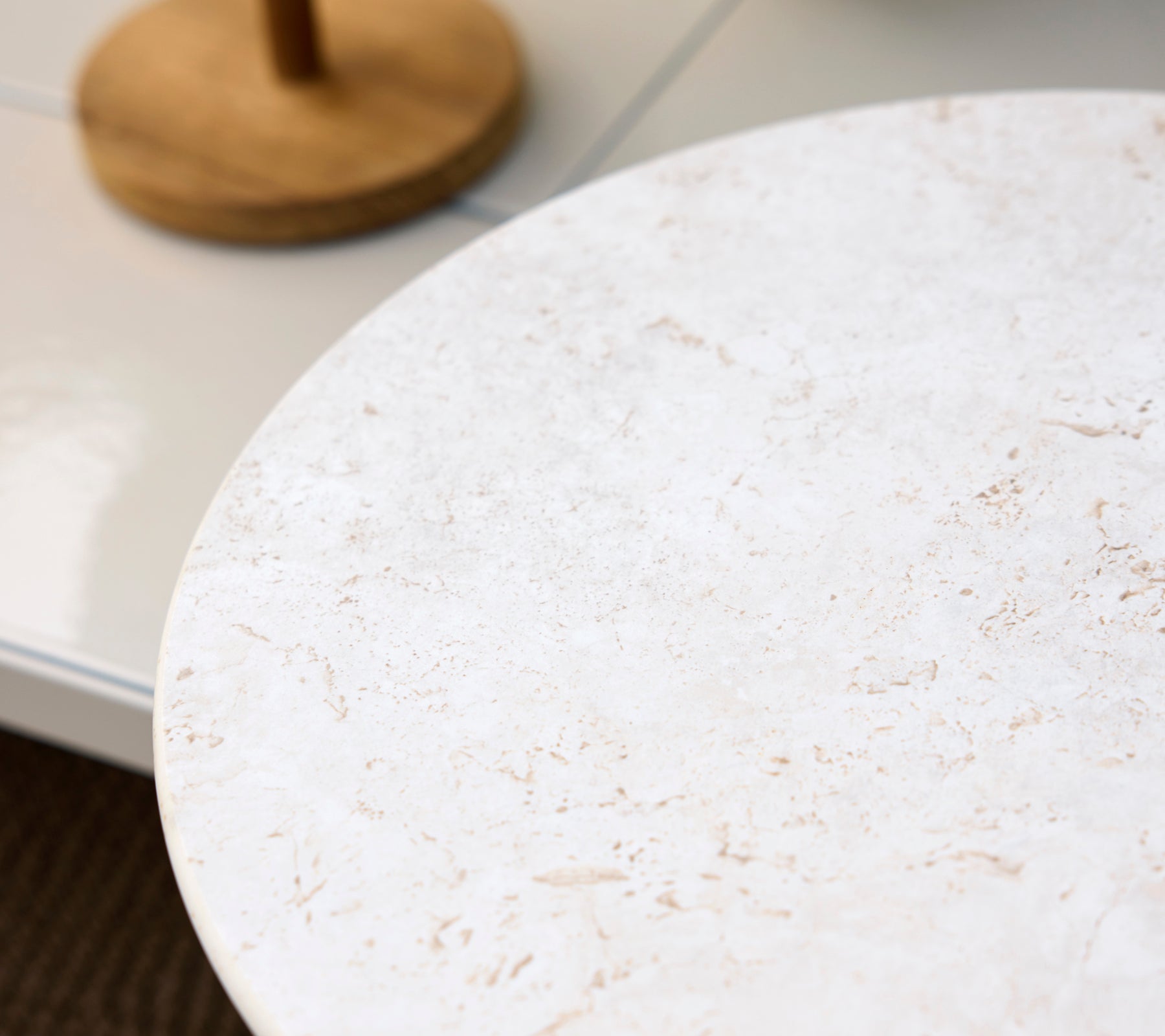 Round white table surface with a light texture.